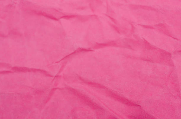istock Intricate Pink Paper Texture: Sharp Creases and Soft Undulating Folds 2253530168