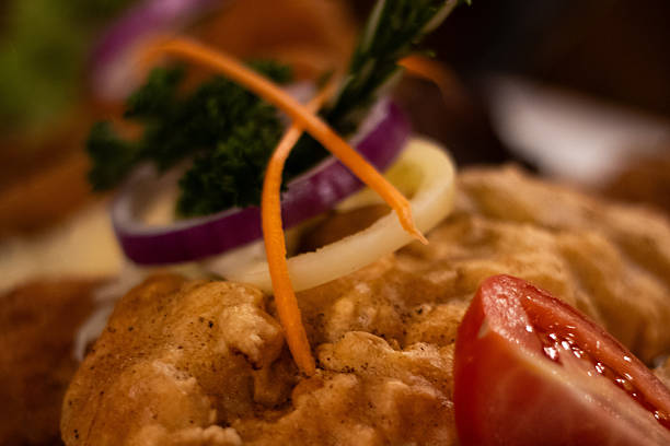 istock crispy battered food with vegetable garnish 2253530550