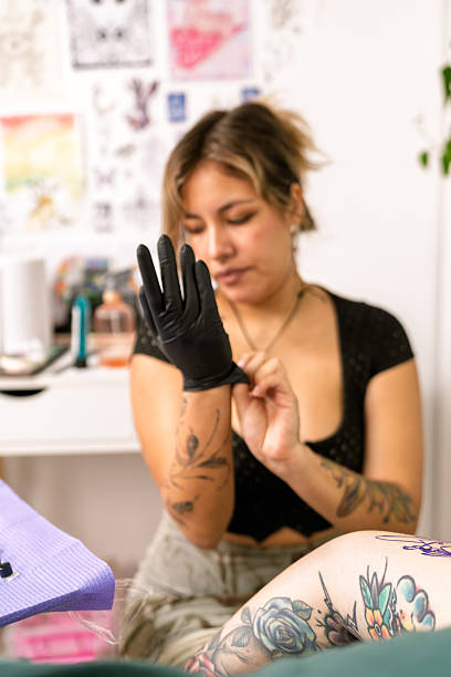 istock Tattoo artist preparing for new tattoo procedure 2253538497
