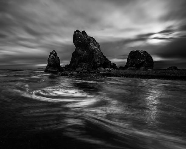 istock Swirling water on the beach 2253539263