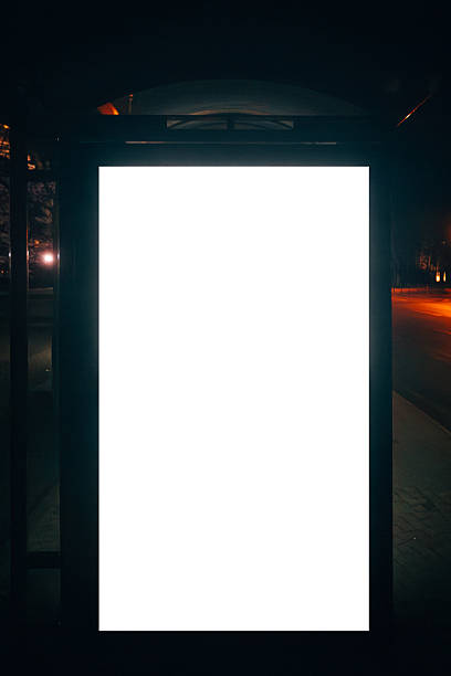 istock Vertical blank advertising display on empty city street at night 2253539686