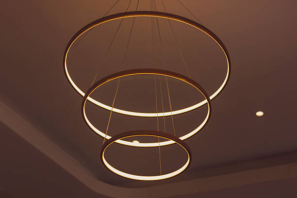 istock Modern ceiling lamp with three rings. Minimalism in the interior 2253540667