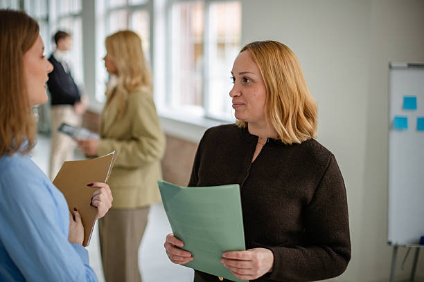 istock Group of adults engaging in discussion and collaboration in an office space during the workday 2253543647