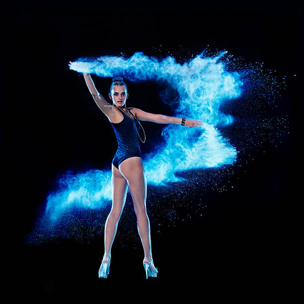 Studio shot of glamorous woman illuminated by blue and orange lights