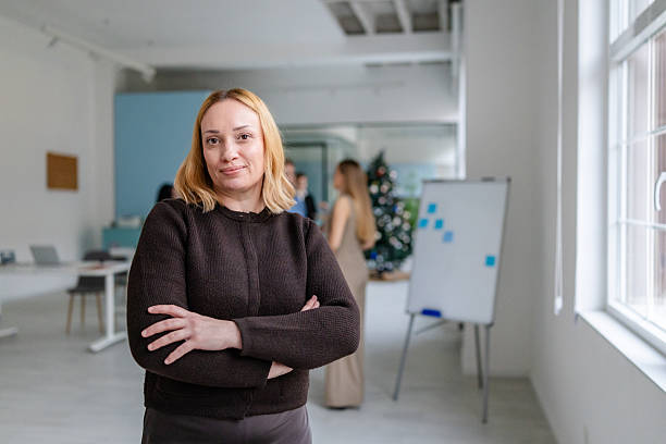 istock Professional adults collaborate in an office setting with a focus on teamwork and engagement during work hours 2253545043
