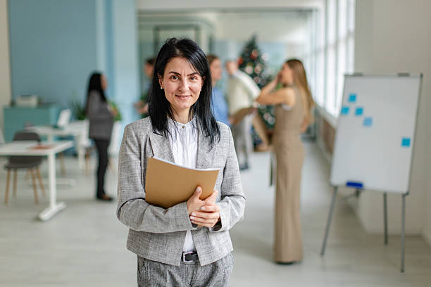 istock Professional working environment in an office with coworkers engaged in activities and discussions 2253545350