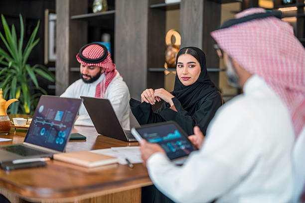 istock Confident Arabic Male and Female Executives Discuss Strategy 2253546504