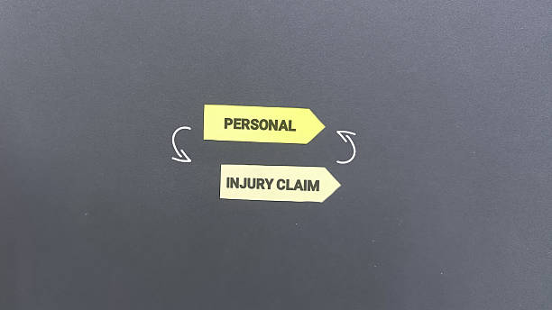istock Personal injury claim concept with directional signs on gray background 2253552646