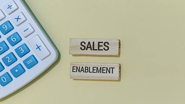 istock Sales enablement strategy with calculator and wooden blocks 2253552864