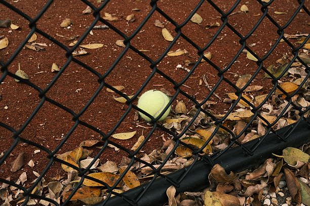 cut rubber ball is creatively placed on a sharp door handle to prevent damage. This unique protective solution showcases an innovative way to enhance safety in home environments