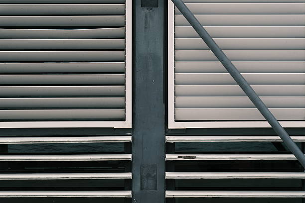 Sun and privacy coverings on the outside of a building.