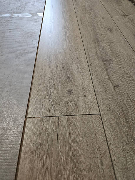 istock New wood-like flooring installation in a bright indoor space 2253558220