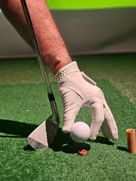 istock Golfer prepares to tee off on a driving range during a sunny afternoon 2253558224