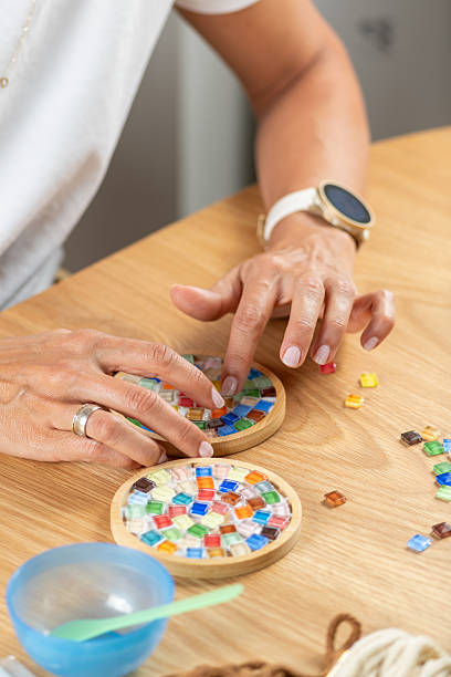 istock Crafting coasters at home using simple materials. Highlights careful hand movement, design focus, and steady creative hobby work. 2253558509