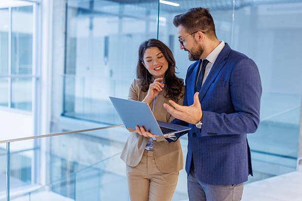 istock Business colleagues collaborating on laptop in modern office 2253559344