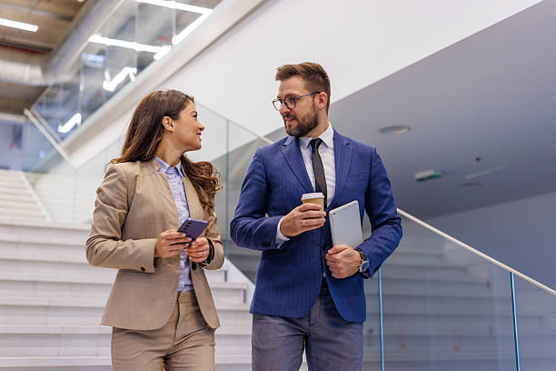 istock Business people discussing ideas in modern office building 2253559441