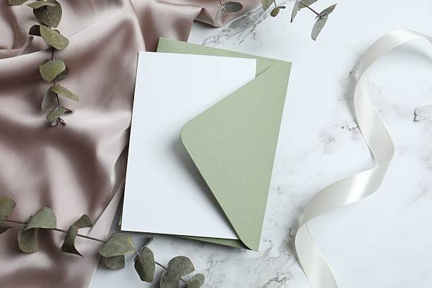 istock Romantic flat lay with paper envelope, blank card, eucalyptus branches on marble. Ideal for wedding invitations, event announcements, or feminine branding 2253566086