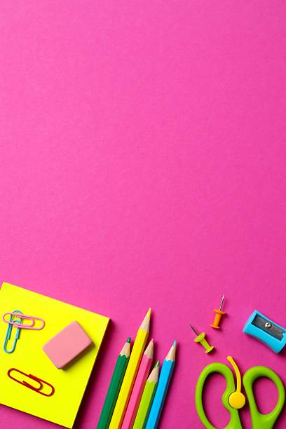 istock School supplies creatively arranged on a color surface, including pencils, scissors and stationery. Top view 2253566842