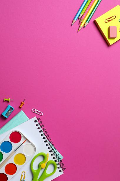 istock School supplies creatively arranged on a color surface, including pencils, scissors and stationery. Top view 2253566851