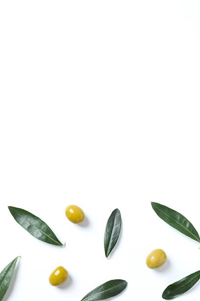 istock Olives and leaves on white background 2253567091