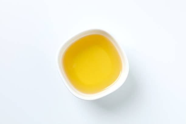 istock Bowl of fresh oil on white background 2253567113