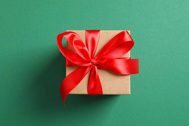 istock Beautiful festive gift box on color background 2253567453