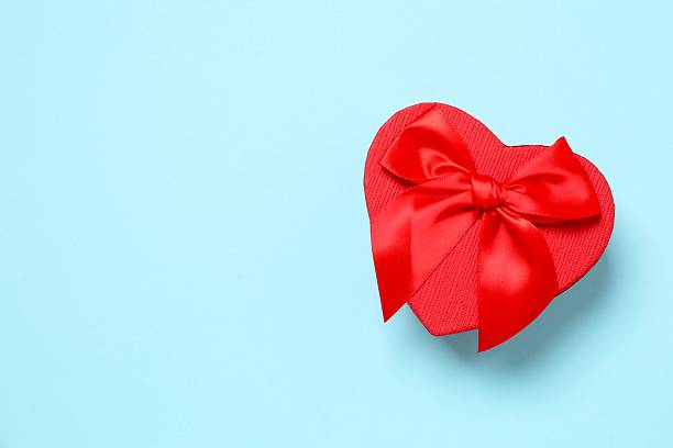 istock Beautiful festive gift box on color background 2253567456