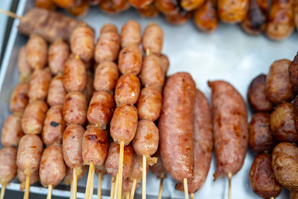 Traditional Handmade German Sausages on Sale at Romer Christmas Market in Frankfurt, Germany