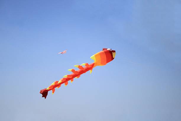Tourists and locals celebrate the kite festival on Corralejo beach in Fuerteventura.