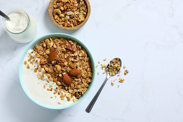 istock Delicious granola with yogurt on a light background 2253569745