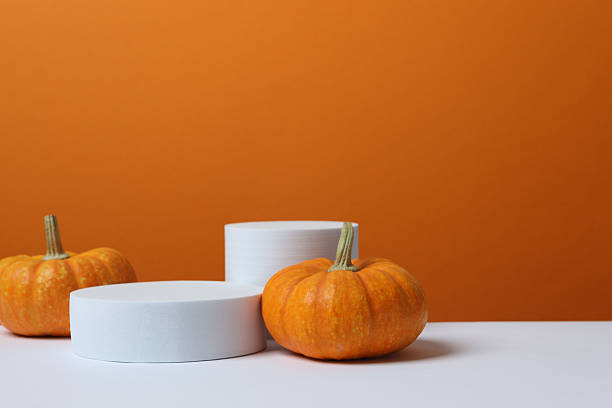 istock White podiums with pumpkin on two tone background 2253570906