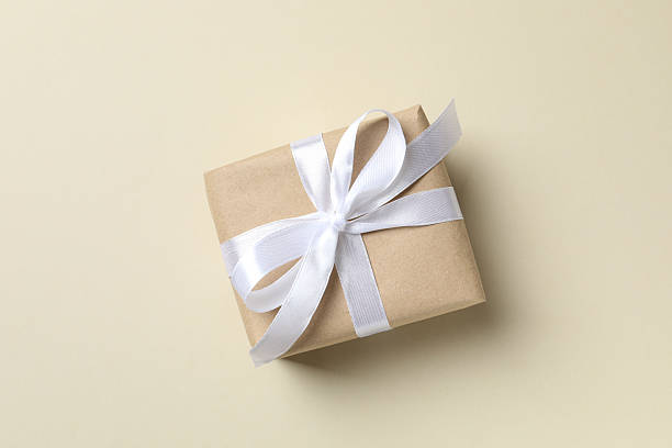 istock Beautiful festive gift box on color background 2253571356