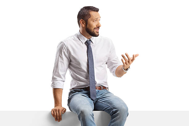 Businessman sitting on a panel and talking isolated on white background