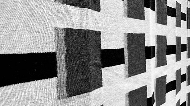 Mid-Century Modern Geometric Woven Textile Texture. Abstract Design Carpet or Rug Close-Up Black, Grey and White Colors. Interior Home Decor Background.