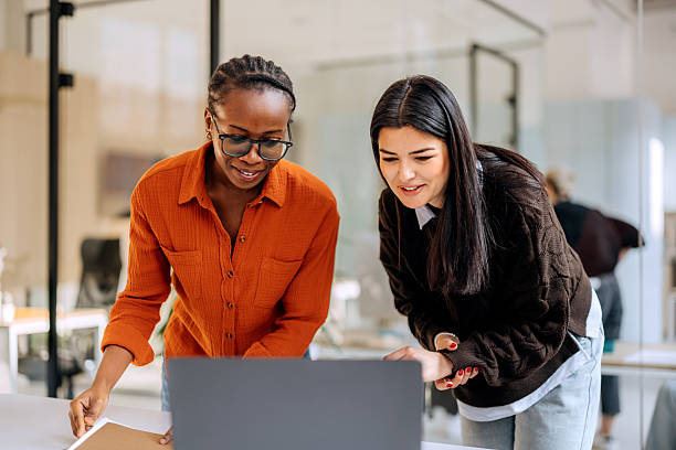 istock Two female coworkers cooperating at the office 2253578236
