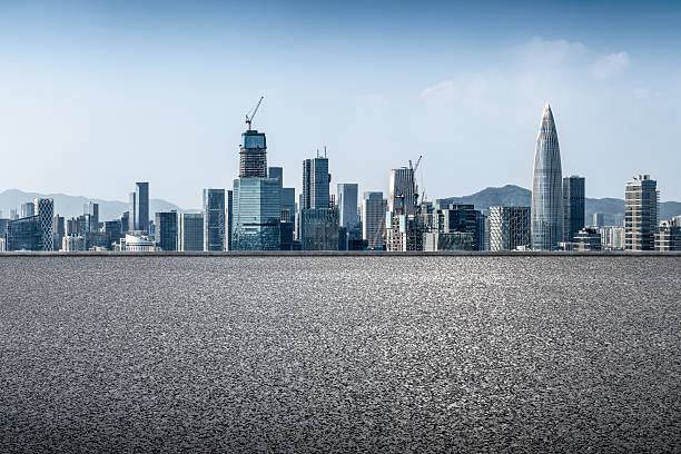 istock Empty asphalt road and modern city skyline with skyscrapers. 2253580662