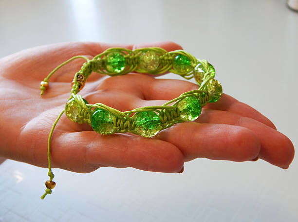 Female hand with friendship bracelet