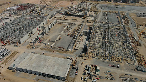 istock Industrial construction site with construction equipment and materials 2253582412
