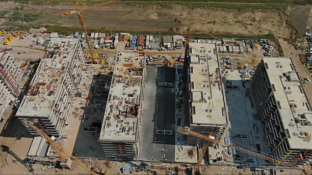 istock Industrial construction site with houses equipment and materials 2253582434