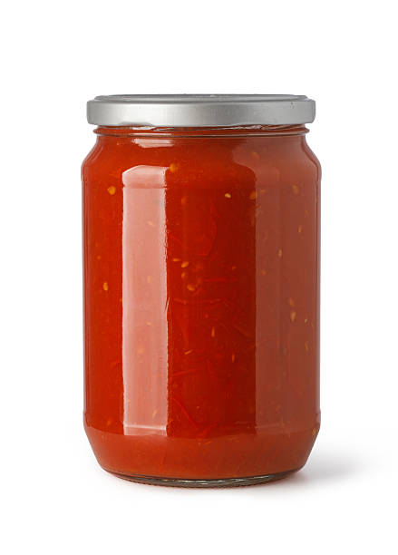 istock Glass jar filled with red tomato pasta sauce 2253589633