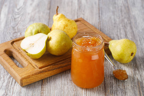 istock Homemade pear jam in a jar with fresh fruit 2253590827