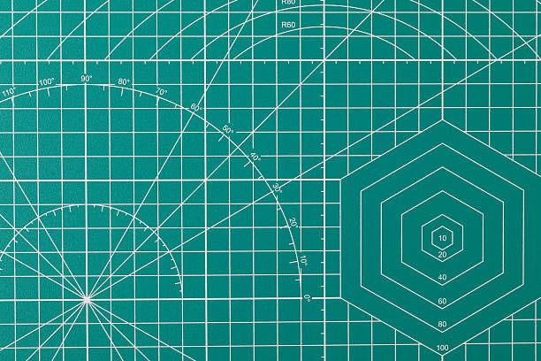 istock Green cutting mat surface with grid and measurement lines 2253590923
