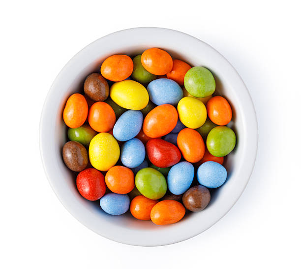 istock Colorful sugar coated candies in white bowl 2253592611