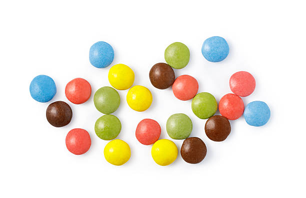 istock Chocolate candies scattered creating colorful sweet background 2253592636