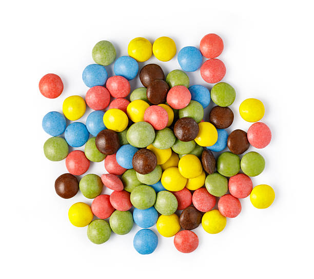 istock Colorful candy coated chocolate buttons forming a sweet pile 2253592648