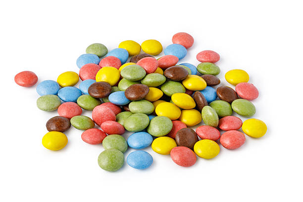 istock Colorful chocolate candies pile on white surface 2253592649