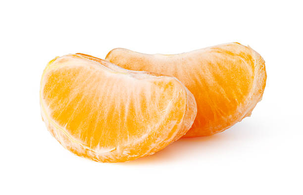 istock Two peeled mandarin orange segments on a white background 2253592707