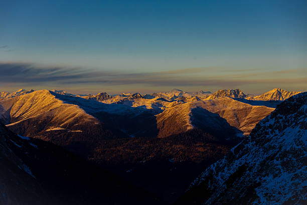 Winter Dolomites mountain landscape with snow covered peaks, alpine ridges, and rocky formations in northern Italy. Cold season environment showing high altitude terrain, dramatic geology, winter travel destination, outdoor nature background, and European Alps scenery