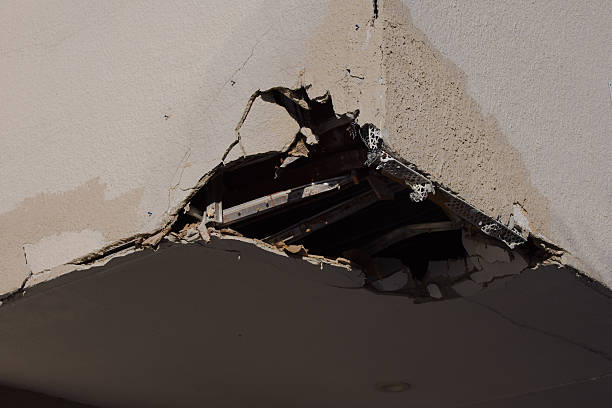 istock Damaged Building Corner With Debris, Cracked Wall Low Overhang 2253599725
