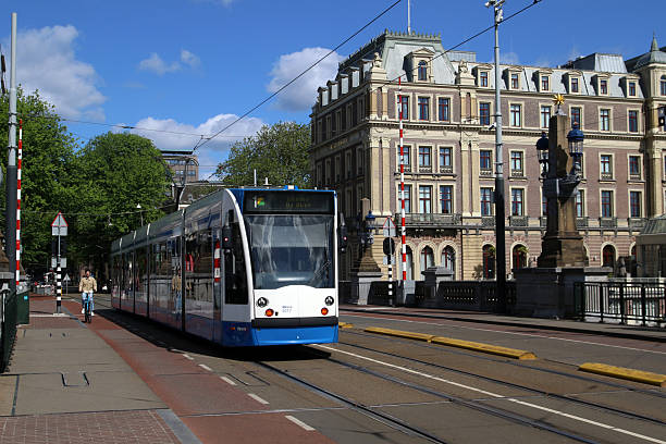 Johan de Witt statue at the “Plaats”, The Hague. Early morning shot with a red streetcar.